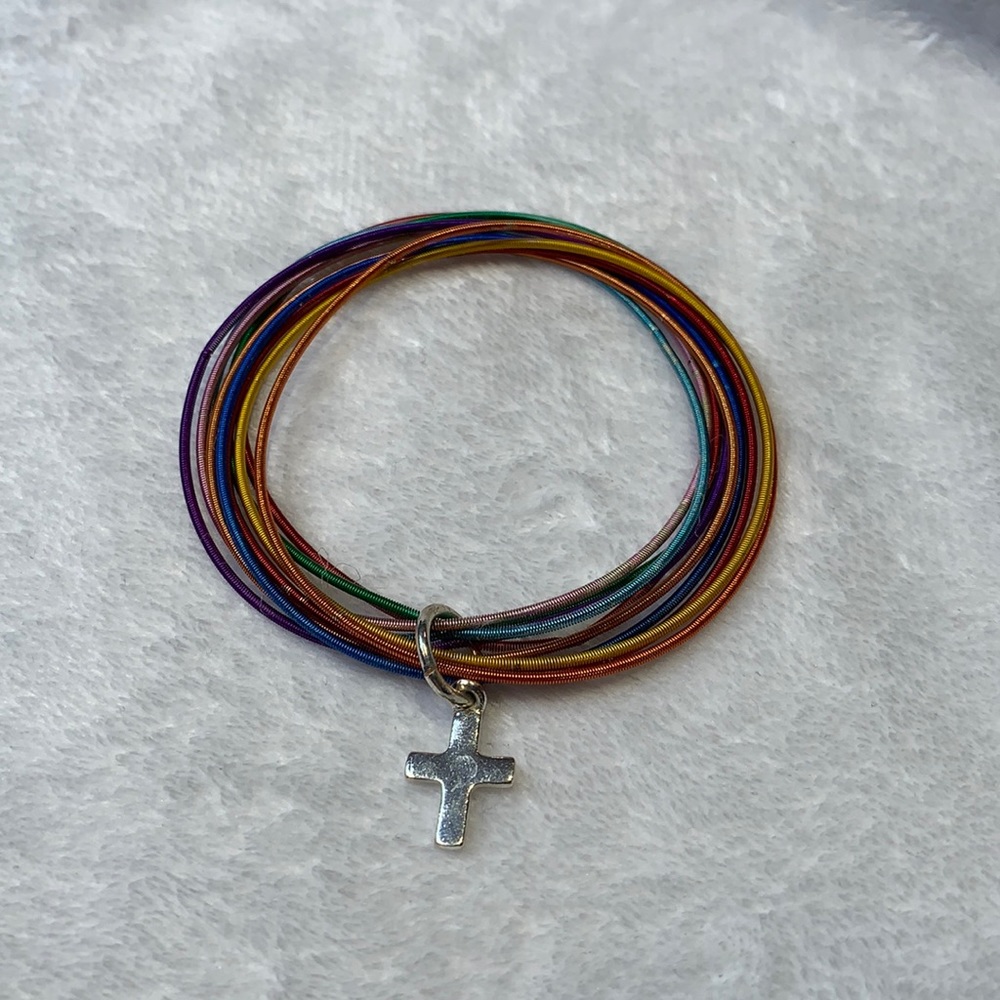 Multi-colored elastic bracelet with a cross charm